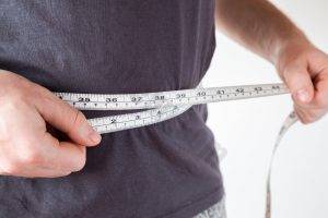 man-with-measuring-tape-around-his-waist-300x200-1